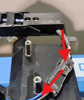 Harness routed to the right of standoffs