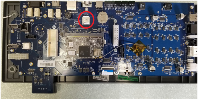 Sliding the SD card latch to unlock and remove the card.