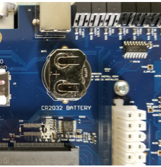Locating the coin battery holder on the underside of the control module.