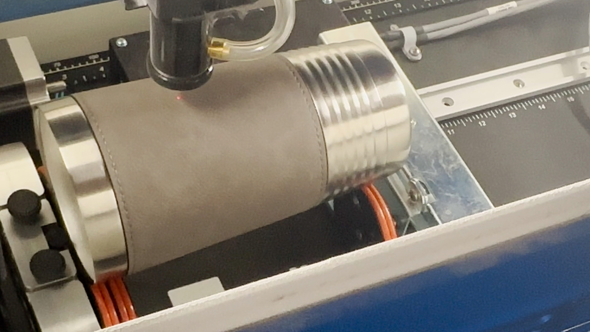 Laser red dot pointer centered on mug
