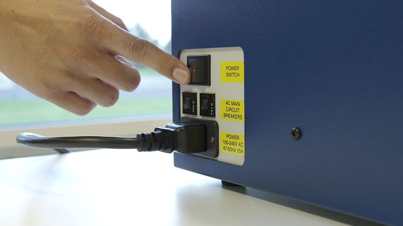 Flipping the machine's power switch to off.