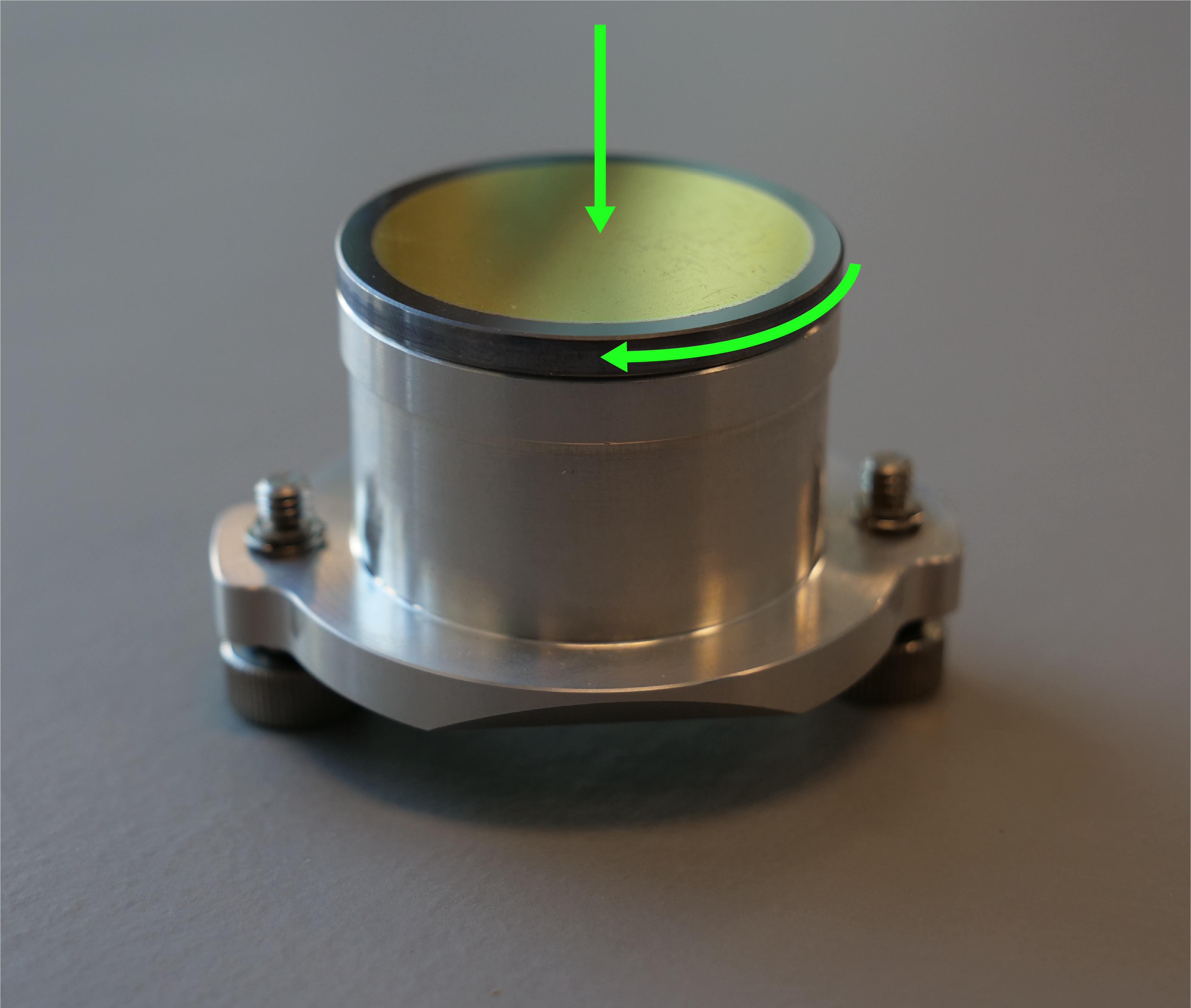 Pressing and rotating the mirror onto the holder