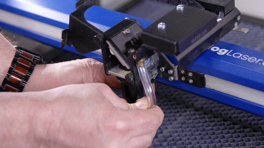 Close-up of hands working on a machine