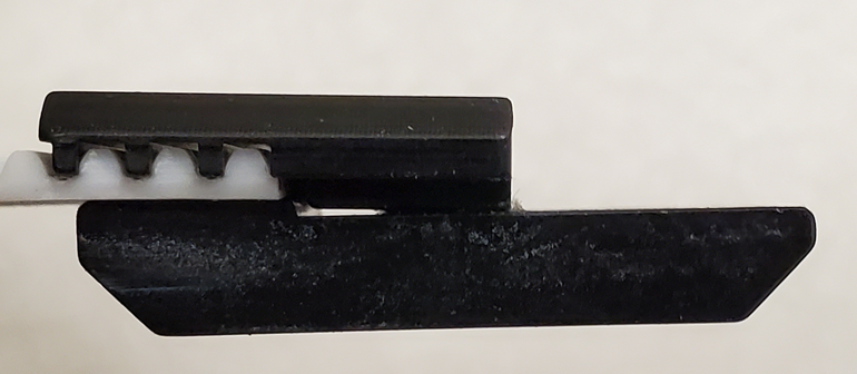Securing clamp to new belt