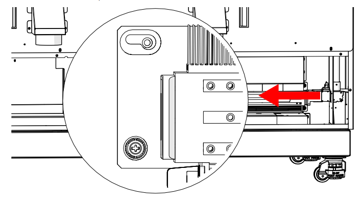 Sliding the tube to the left to disengage guide pin.