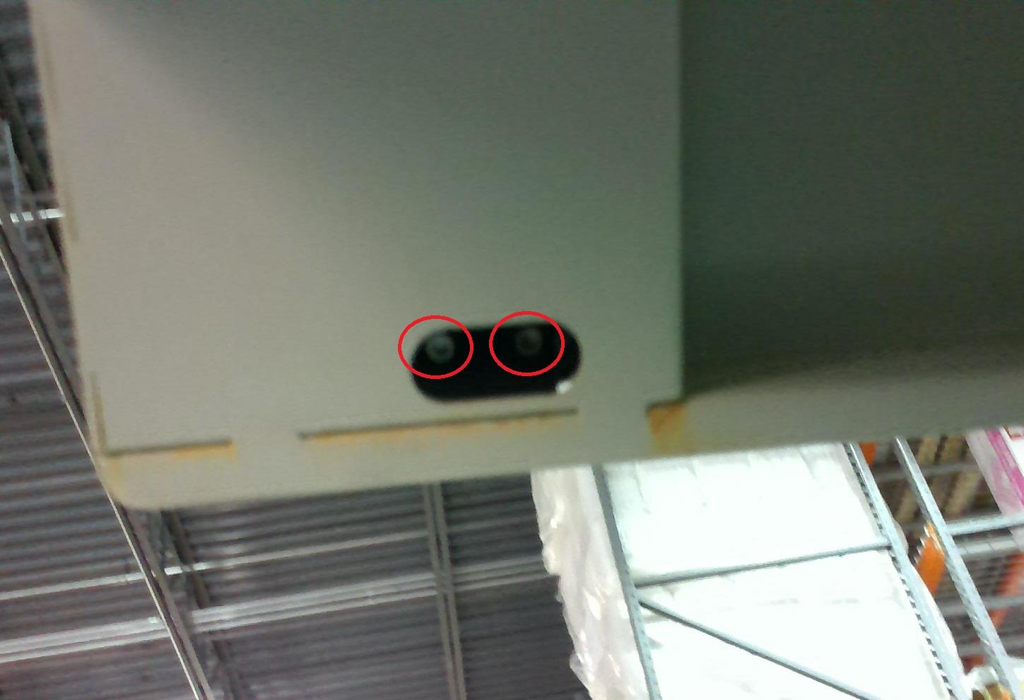 Close-up view of the door interlocks and hex screws.