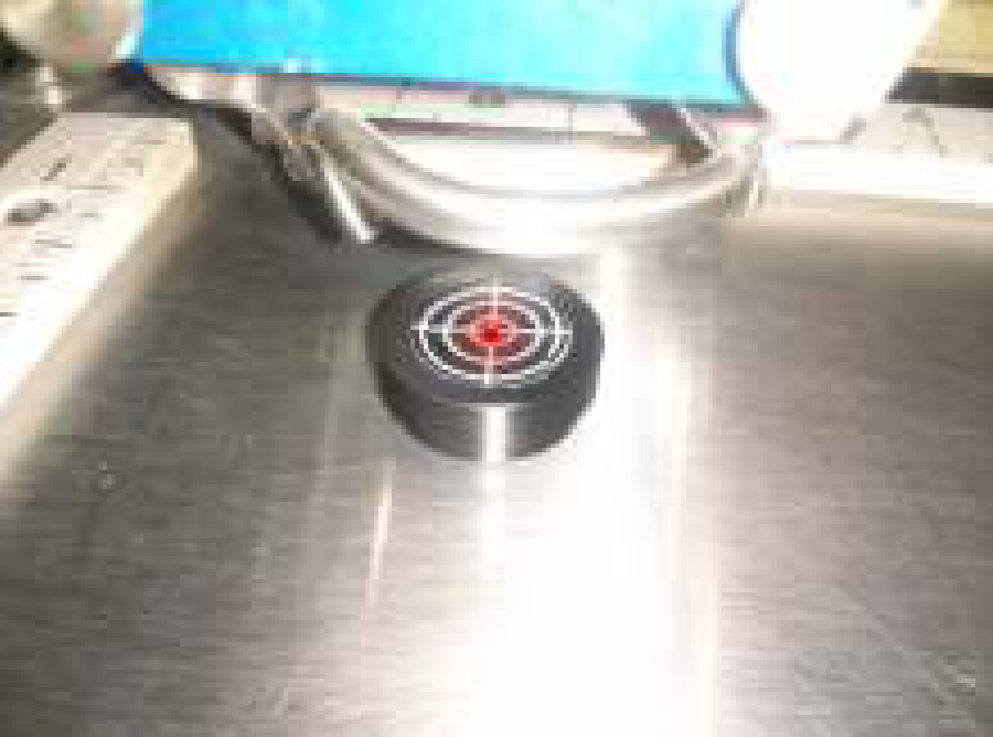 red dot on target on table