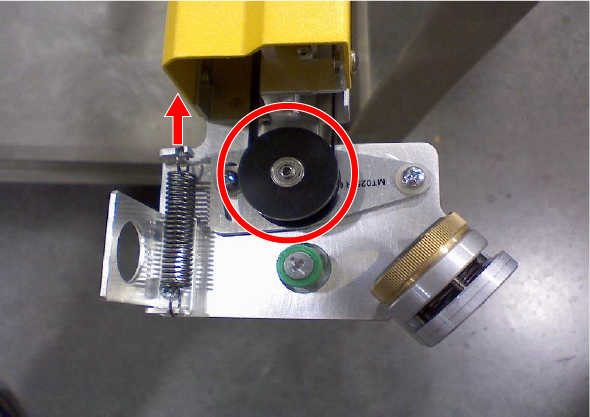 Pulley pushed to the right to release belt tension