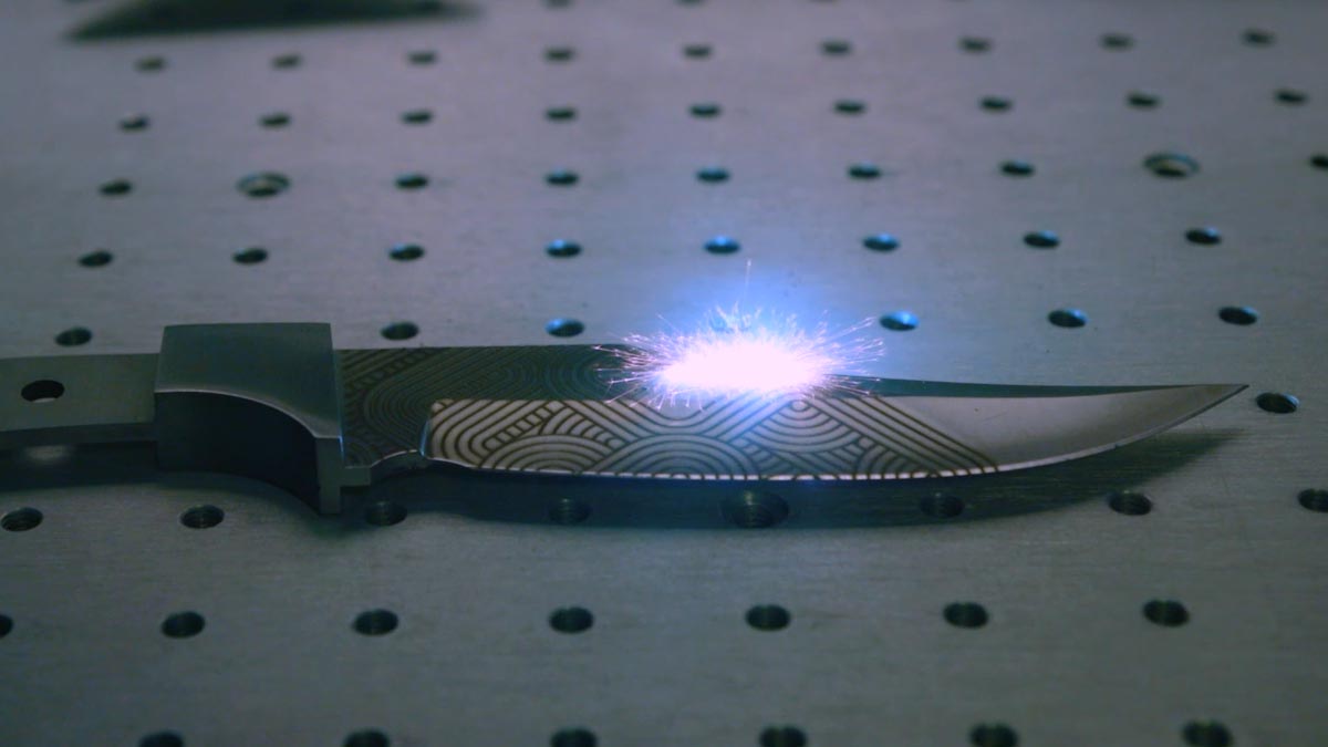 knife engraving in process with camera